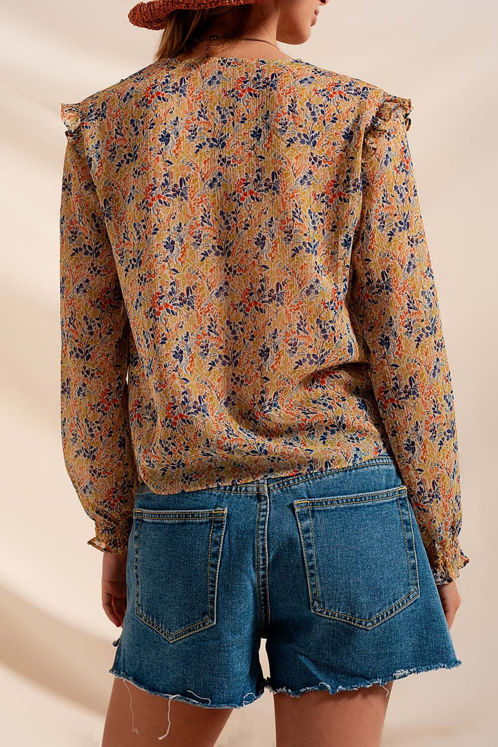 Blusa con estampado floral metalizado en verde