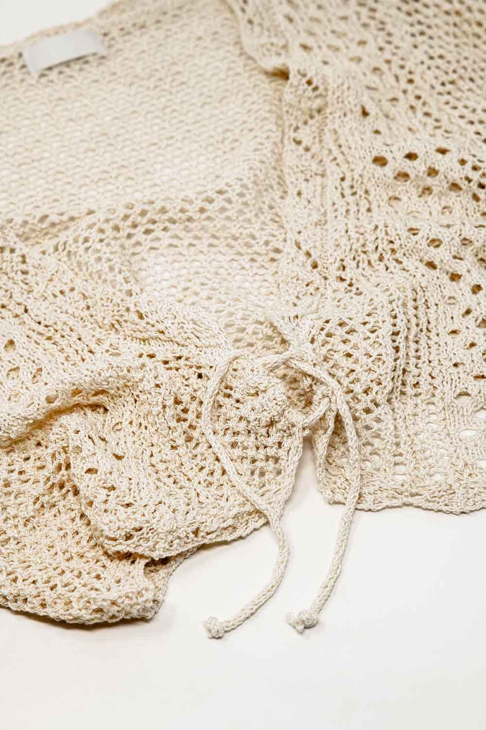 Chaqueta de punto beige con cierre de lazo