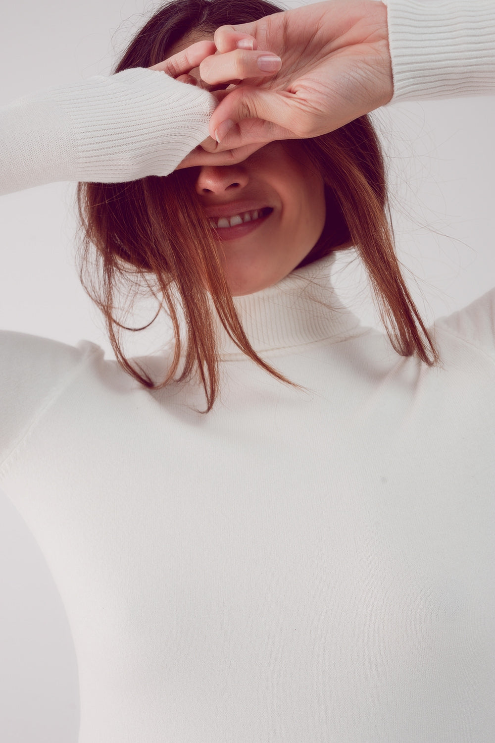 Jersey crema con cuello alto