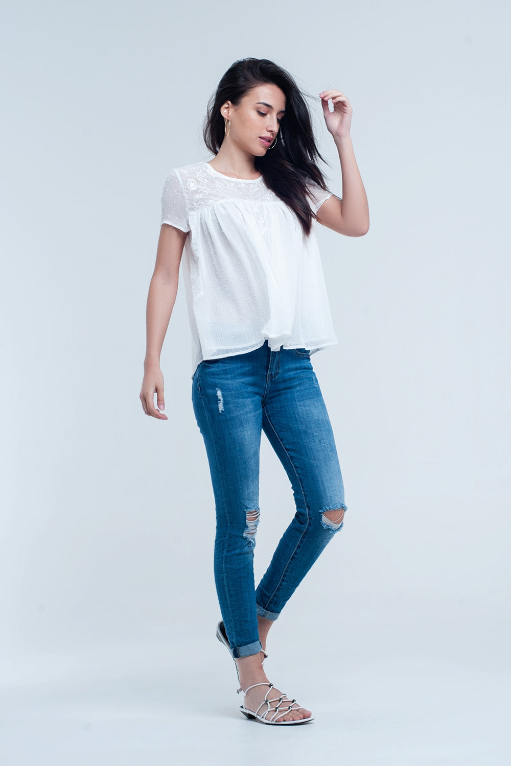 Pantalon vaquero ajustado elastico con rasgaduras