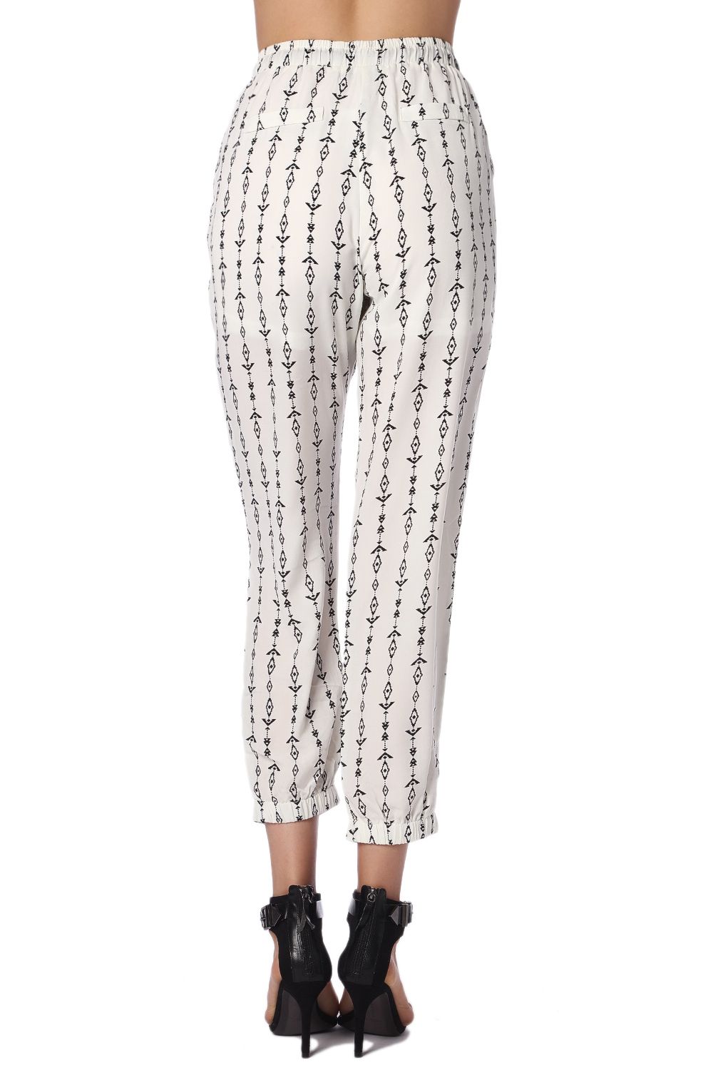 Pantalones crema con estampado azteca en contraste