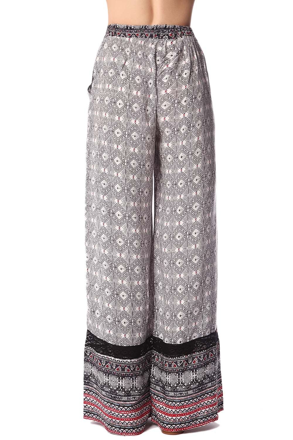 Pantalones de pernera amplia con estampado etnico negro y detalle de puntilla