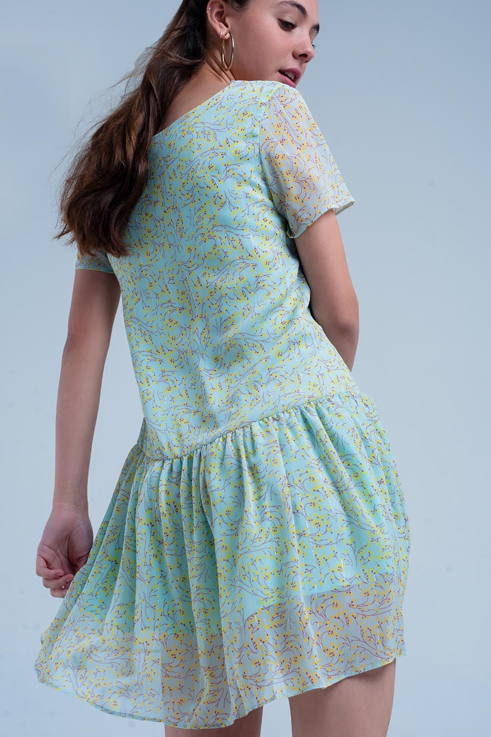 Vestido verde estampado con falda plisada