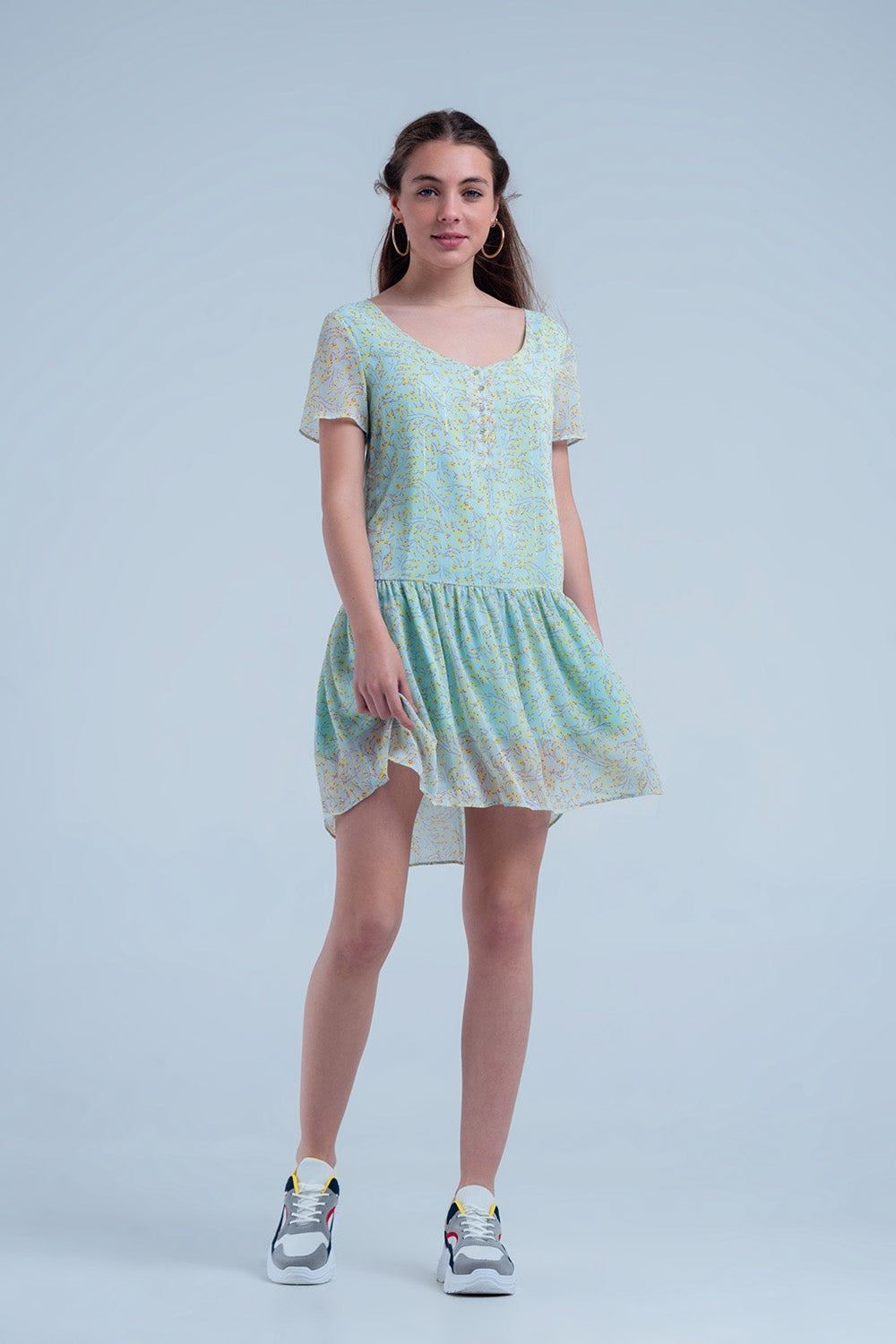 Vestido verde estampado con falda plisada