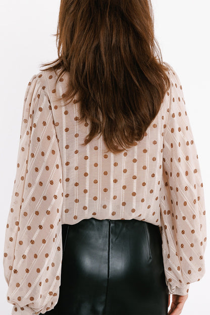 Blusa con mangas globo y lunares en beige