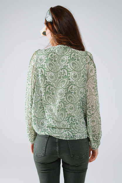 Blusa de gasa verde con estampado floral y mangas globo largas