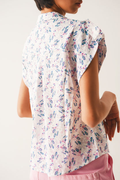 Blusa morada con bolsillos y estampado de florecitas