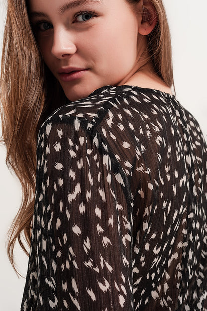 Blusa transparente de manga larga con estampado