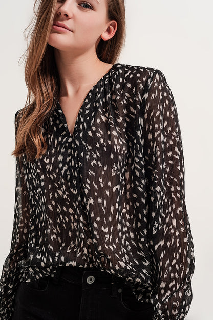Blusa transparente de manga larga con estampado