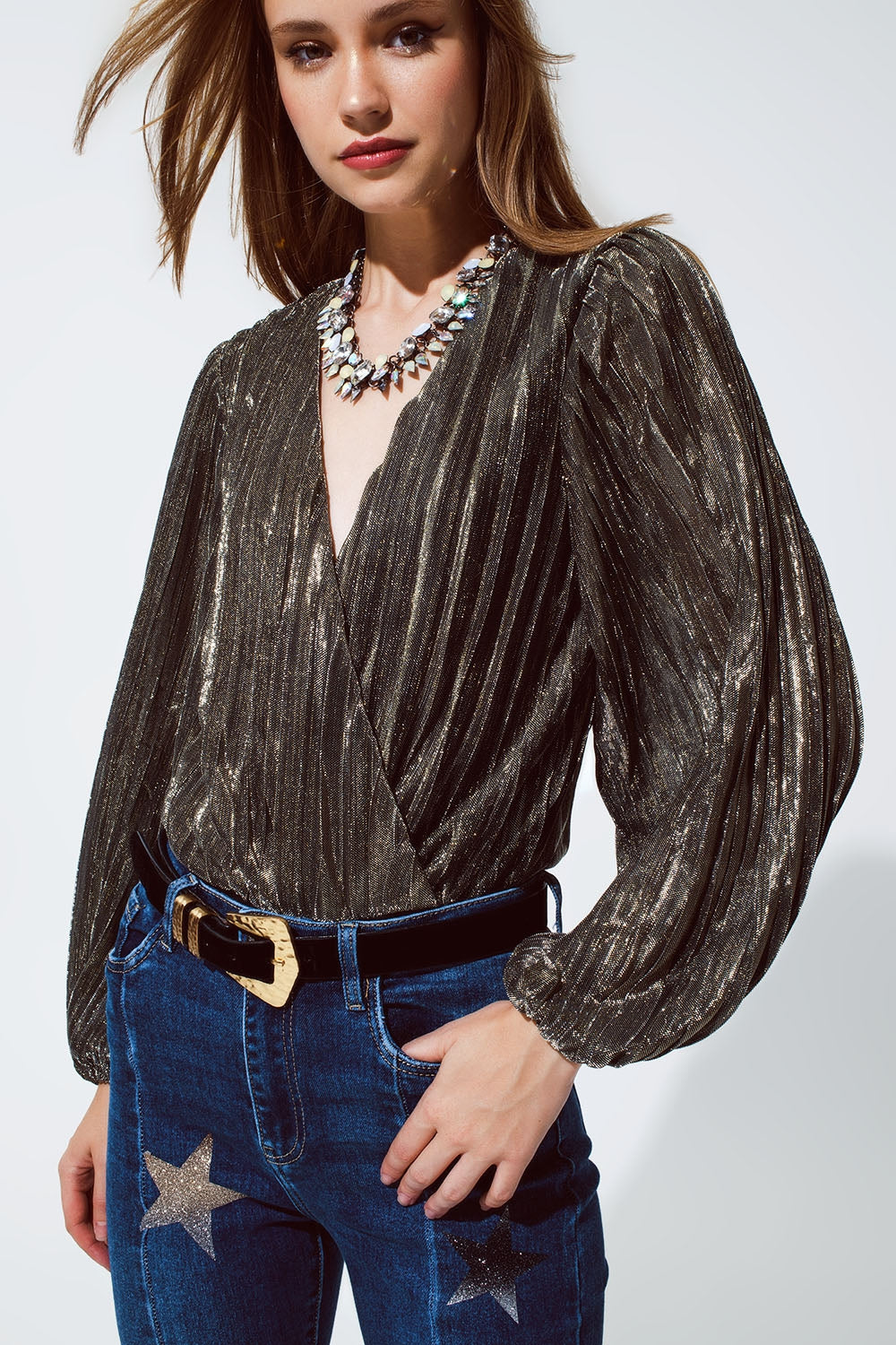 Body con brillo con escote en V profundo en color dorado