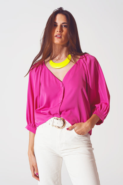 Camisa color fucsia abotonada con parte delantera de satén