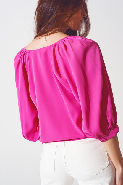 Camisa color fucsia abotonada con parte delantera de satén