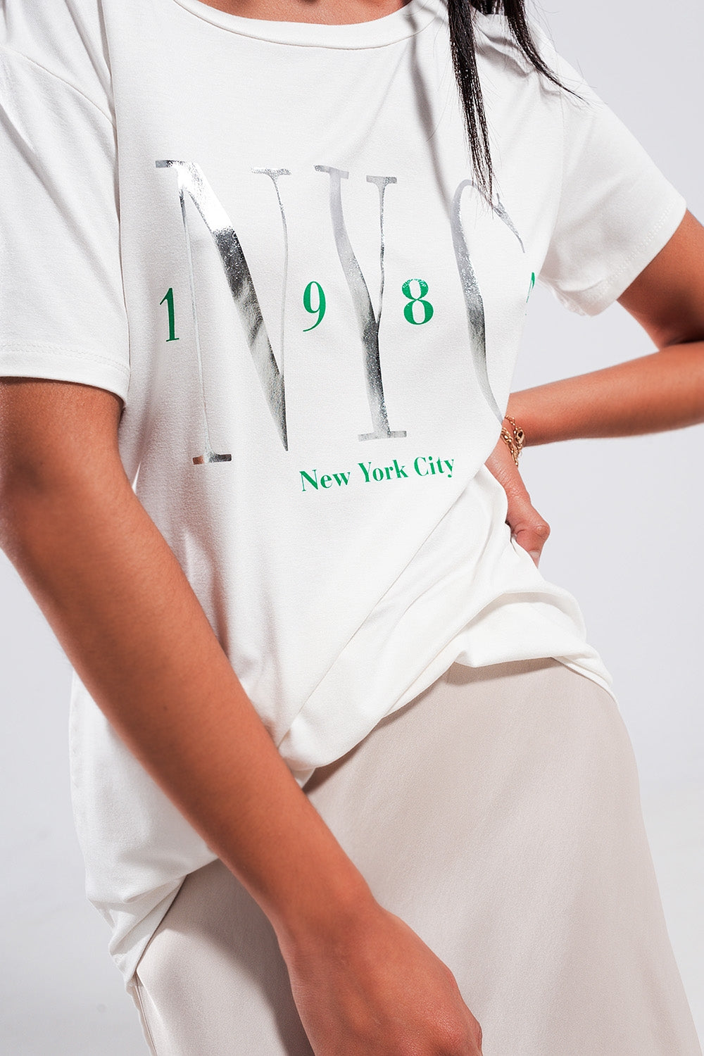 Camiseta blanca con texto New York City