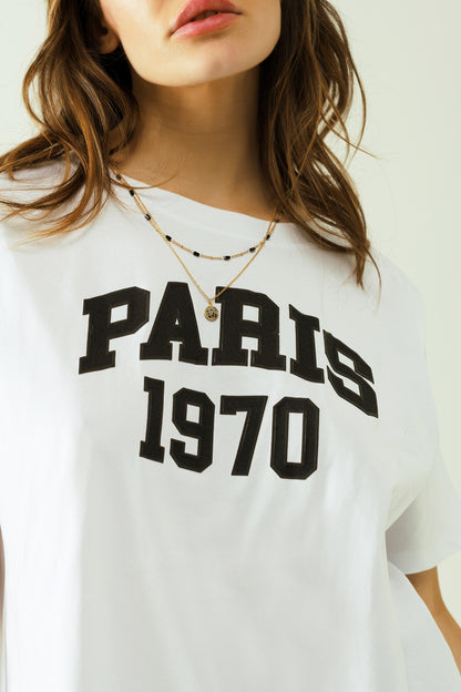 Camiseta blanca oversize estampada paris 1970 en negro