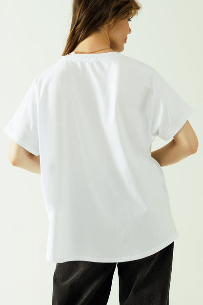 Camiseta blanca oversize estampada paris 1970 en negro