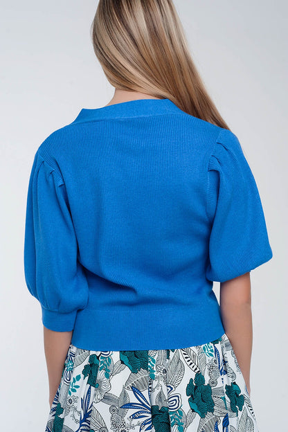 Cárdigan azul con mangas voluminosas