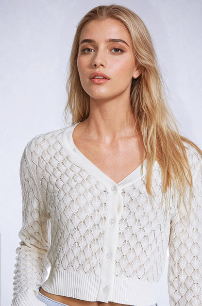 Cárdigan corto beige con estampado de rombos