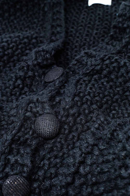 Chaqueta negra oversize de punto grueso con bolsillos
