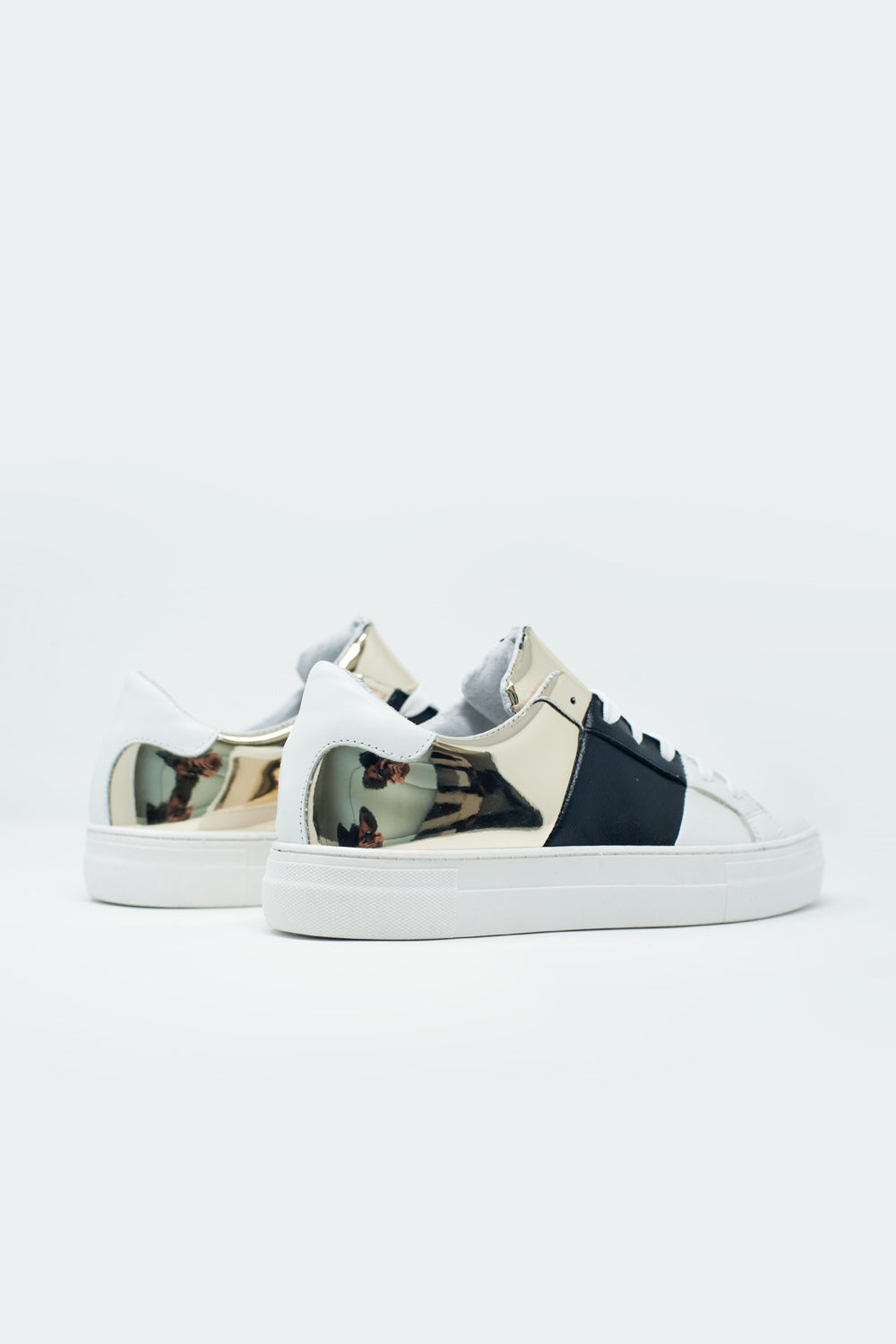 Chunky sneakers en negro y dorado