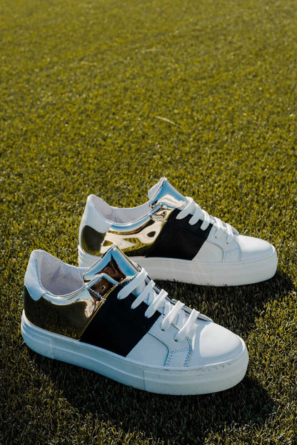 Chunky sneakers en negro y dorado