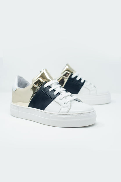 Chunky sneakers en negro y dorado