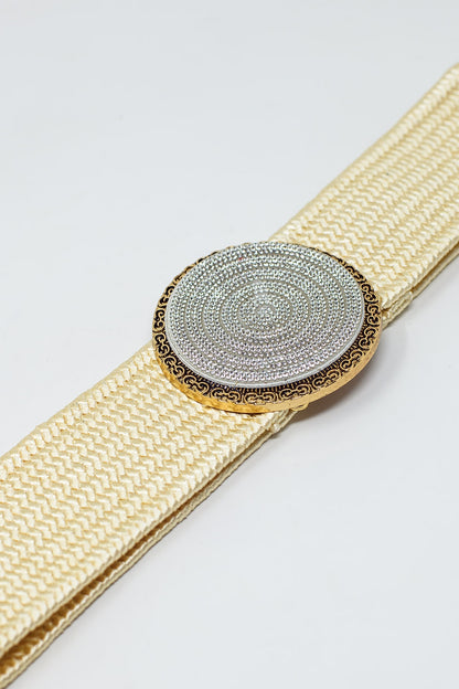 Cinturón tejido en color crema con hebilla redonda con strass