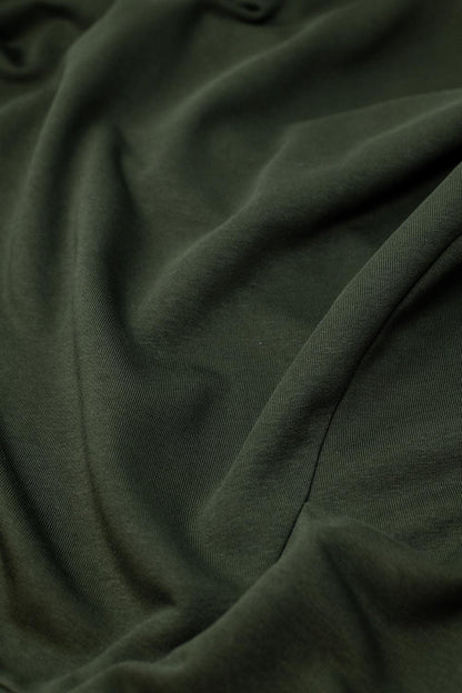 Cómodo jersey verde con cuello redondo