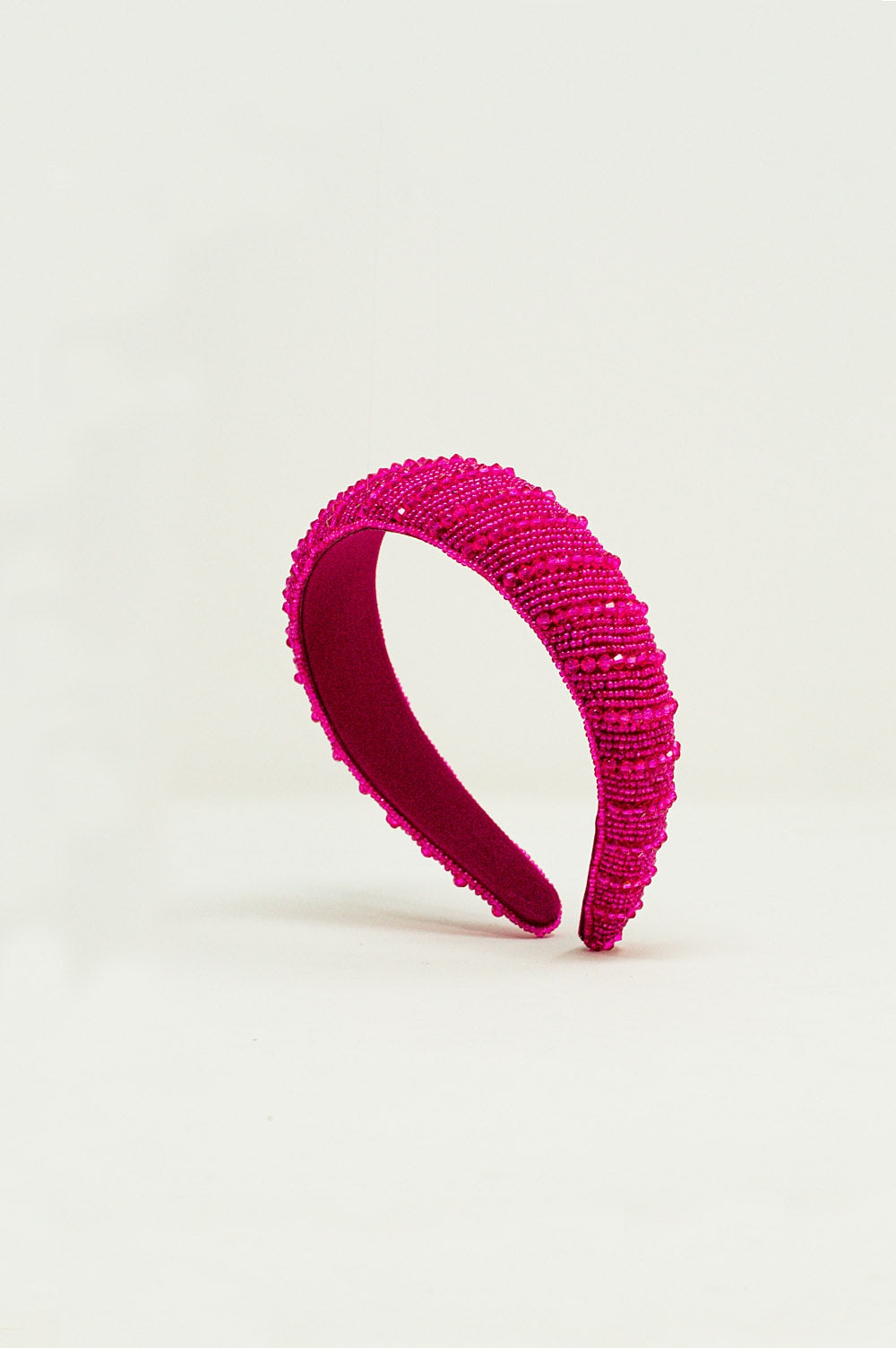 Diadema con cuentas en fucsia