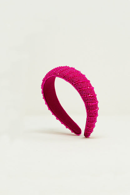Diadema con cuentas en fucsia