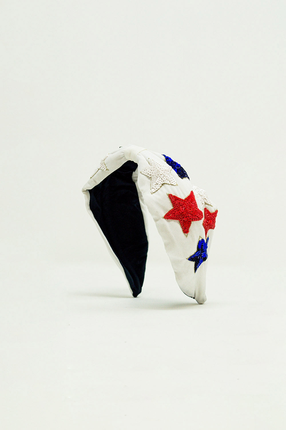 Diadema con estrellas de lentejuelas en blanco