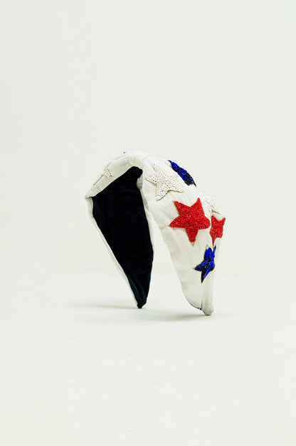 Diadema con estrellas de lentejuelas en blanco
