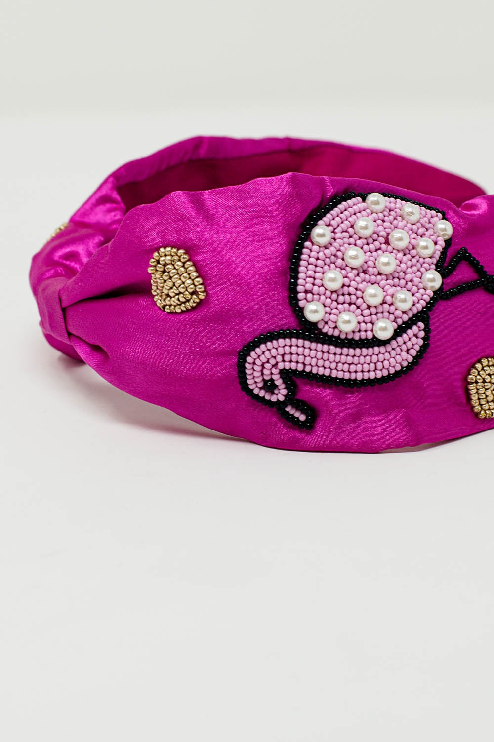 Diadema de satén en color fucsia con flamencos bordados