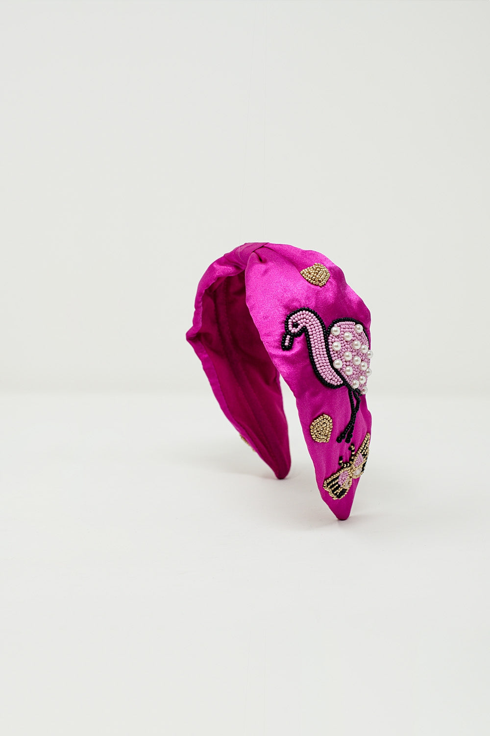 Diadema de satén en color fucsia con flamencos bordados