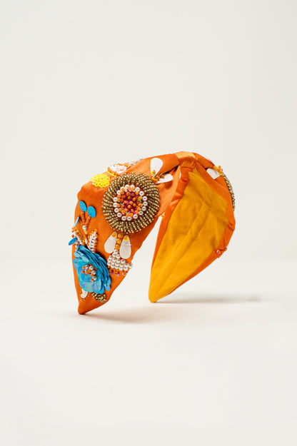 Diadema naranja con adornos