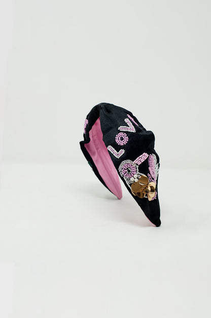 Diadema negra con pájaro bordado