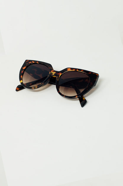 Gafas de sol de ojos de gato extragrandes con bordes anchos en carey