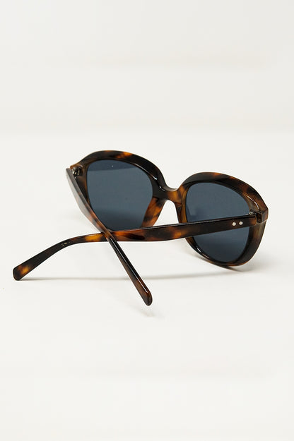 Gafas de sol redondas en carey oscuro