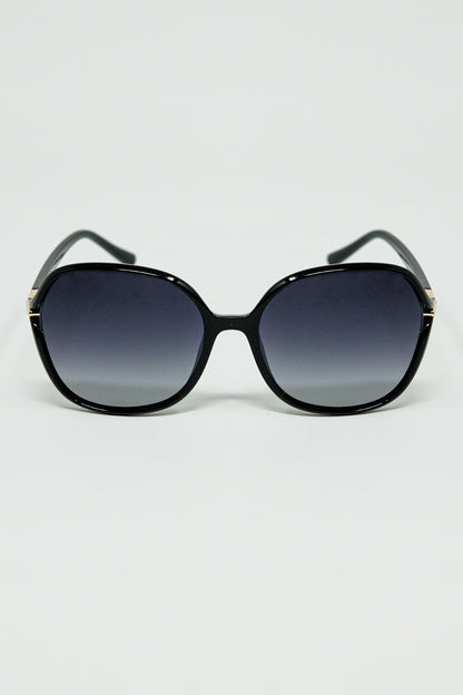 Q2 Gafas de sol redondas en negro con detalle metálico dorado