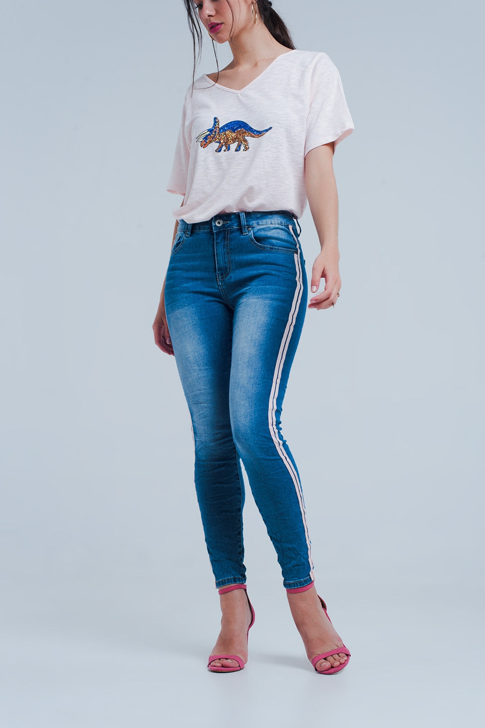 Jeans ajustados con rayas laterales en color rosa