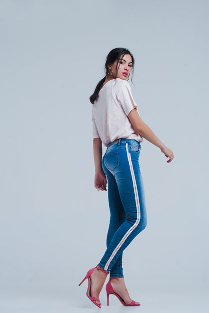Jeans ajustados con rayas laterales en color rosa
