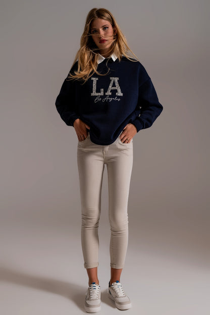 Jeans beige tobilleros con arrugas suaves