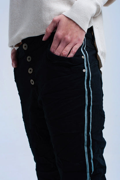 Jeans boyfriend negros con botones