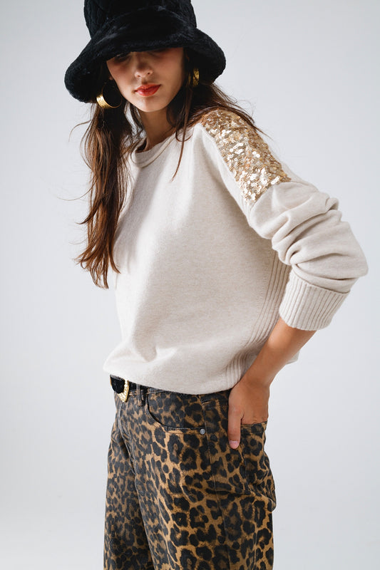Q2 Jersey beige de manga larga con lentejuelas en los hombros