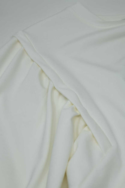 Jersey blanco de manga larga con detalles de costura frontal en los laterales