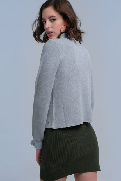 Jersey con volantes en gris