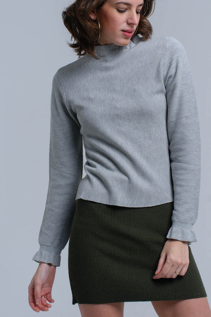 Jersey con volantes en gris