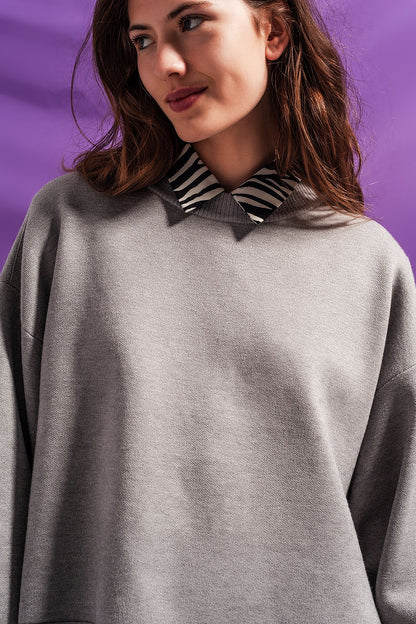 Jersey corto gris con mangas murciélago