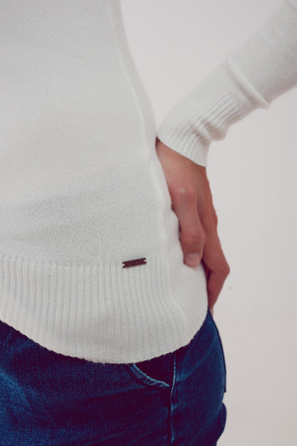 Jersey crema con cuello alto