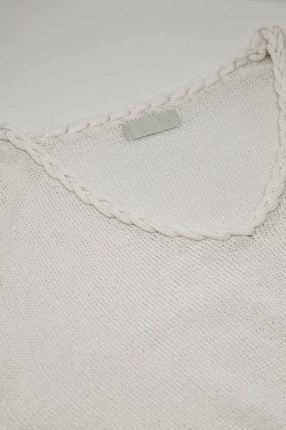 Jersey crema cuello pico ancho con detalle trenzado