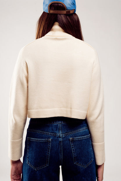 Jersey cropped de cuello alto en crema